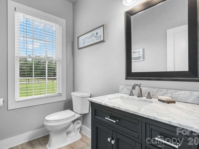 1100 Rainbow Drive, Mount Holly, NC 28120.  MLS# CAR4388731, YatesRealty ID 27444. Hall half bath