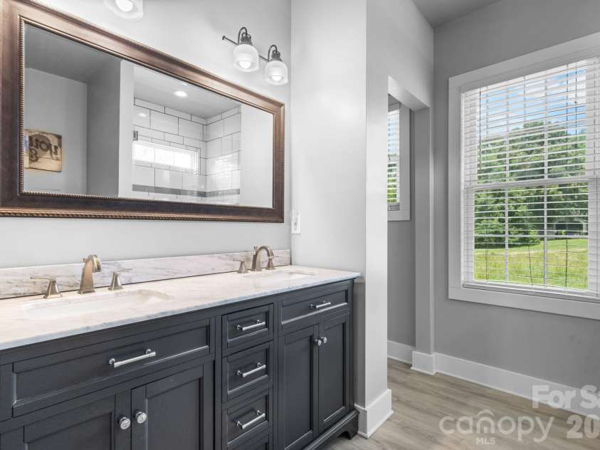 1100 Rainbow Drive, Mount Holly, NC 28120.  MLS# CAR4388731, YatesRealty ID 27444. Primary bathroom
