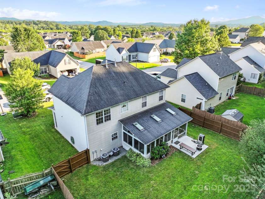 138 Black River Road, Fletcher, NC 28732.  MLS# CAR4282304, YatesRealty ID 27446. Elevated drone view/backyard