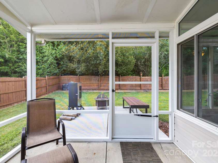 138 Black River Road, Fletcher, NC 28732.  MLS# CAR4282304, YatesRealty ID 27446. Screened sun room