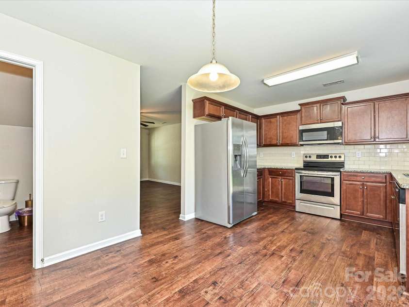 6709 Broad Valley Court, Charlotte, NC 28216.  MLS# CAR4388395, YatesRealty ID 27447. Dining Area and kitchen