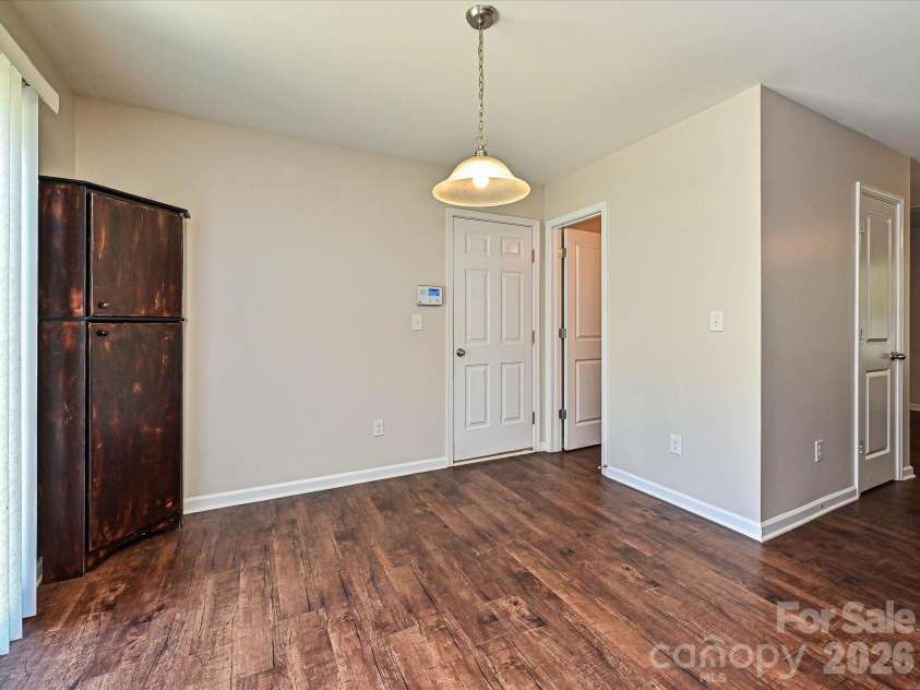 6709 Broad Valley Court, Charlotte, NC 28216.  MLS# CAR4388395, YatesRealty ID 27447. Dining area, half bathroom
