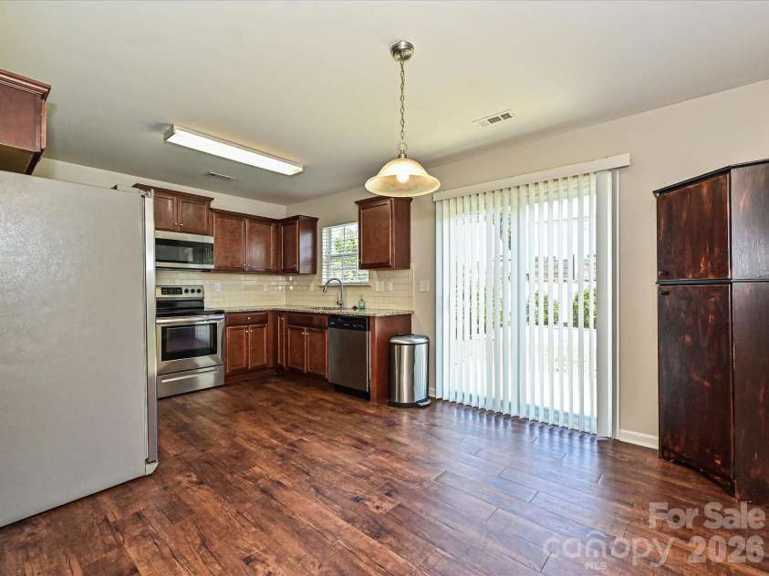 6709 Broad Valley Court, Charlotte, NC 28216.  MLS# CAR4388395, YatesRealty ID 27447. Kitchen, dinning area