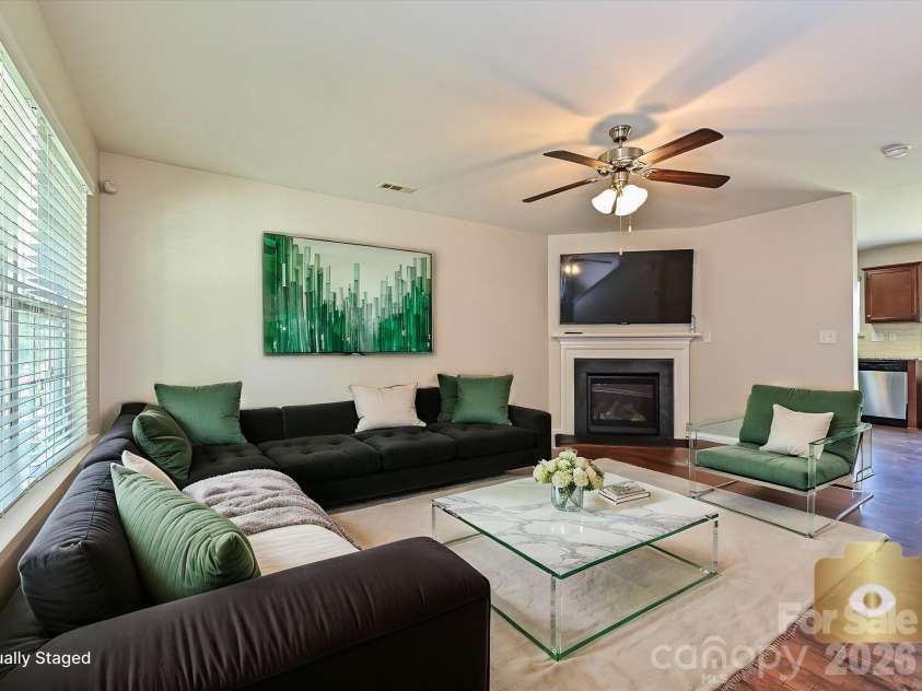 6709 Broad Valley Court, Charlotte, NC 28216.  MLS# CAR4388395, YatesRealty ID 27447. Virtually staged Living room