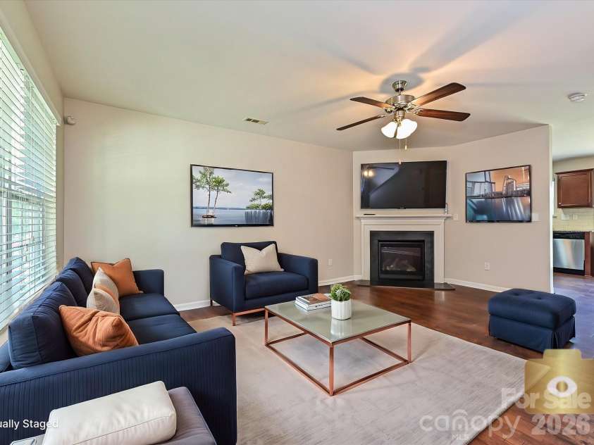 6709 Broad Valley Court, Charlotte, NC 28216.  MLS# CAR4388395, YatesRealty ID 27447. Virtually staged living room
