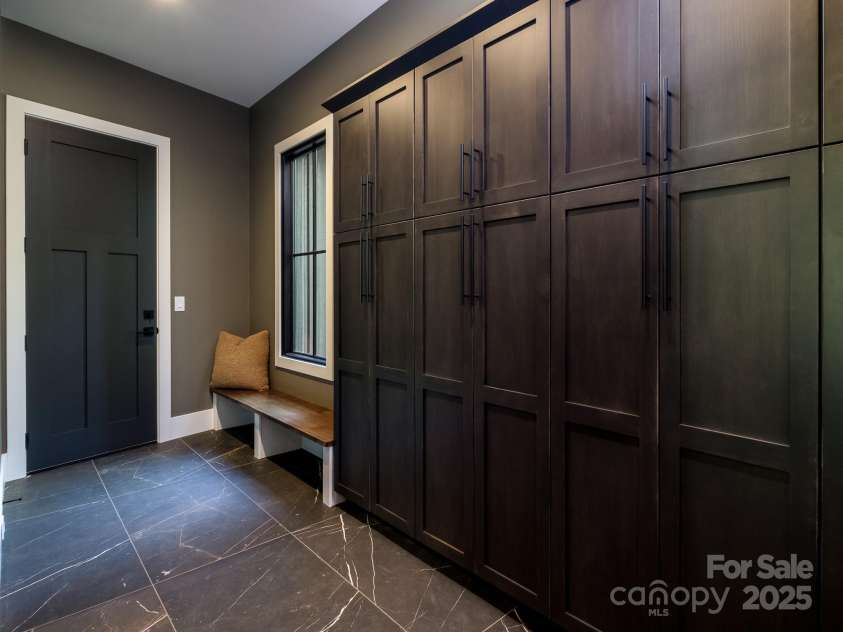 115 Rockbrook Overlook, Brevard, NC 28712.  MLS# CAR4281604, YatesRealty ID 27448. Mudroom off garage with additional storage