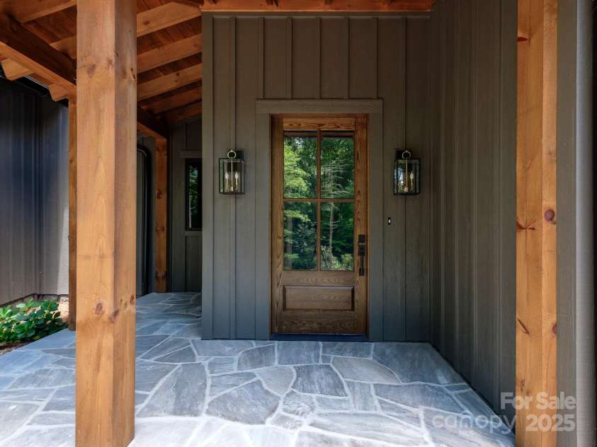 115 Rockbrook Overlook, Brevard, NC 28712.  MLS# CAR4281604, YatesRealty ID 27448. Site sawn post and beam front entry
