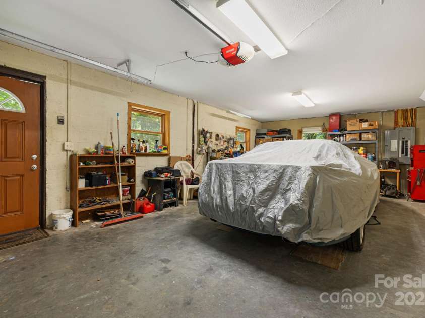 66 Volunteer Drive, Burnsville, NC 28714.  MLS# CAR4278537, YatesRealty ID 27449. Basement Garage