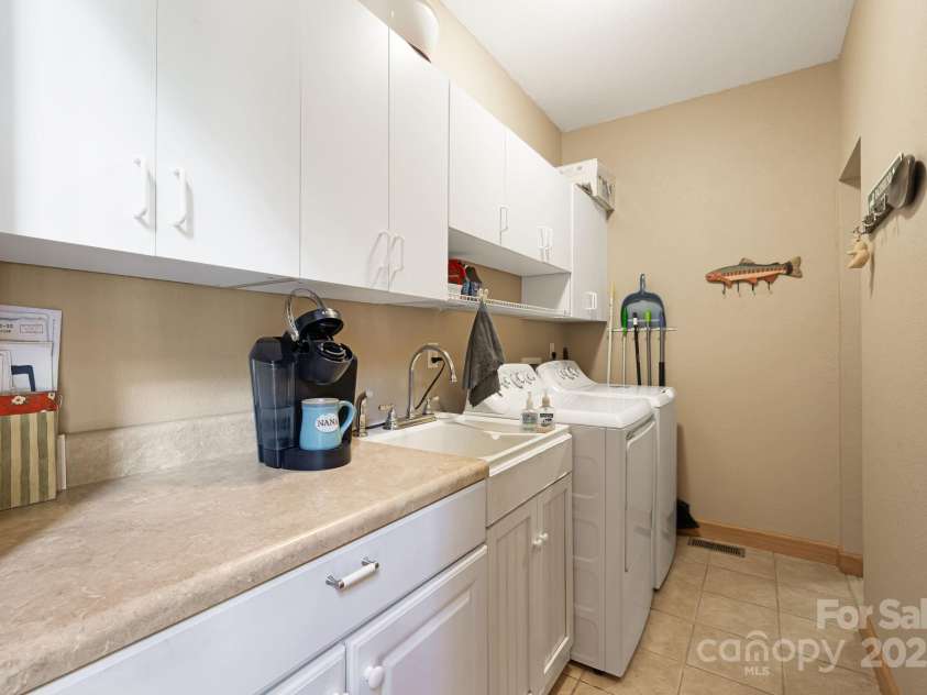 66 Volunteer Drive, Burnsville, NC 28714.  MLS# CAR4278537, YatesRealty ID 27449. Laundry/Storage