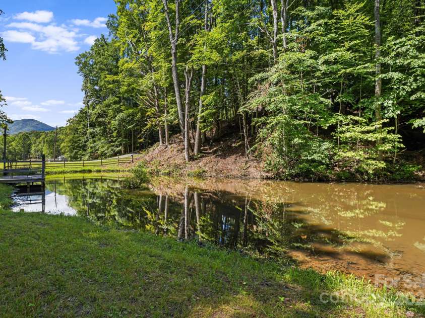 66 Volunteer Drive, Burnsville, NC 28714.  MLS# CAR4278537, YatesRealty ID 27449. Stocked Pond!!!