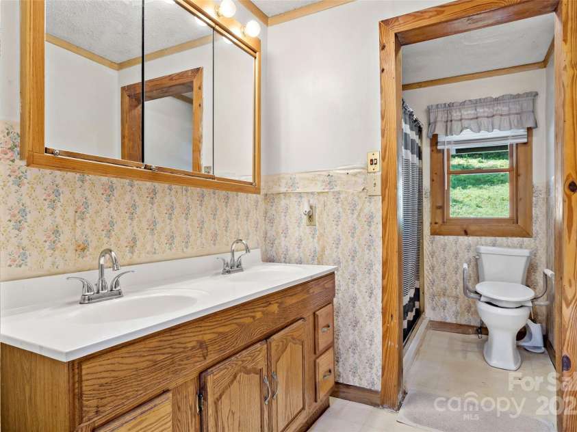100 Goose Creek Road, Marion, NC 28752.  MLS# CAR4166247, YatesRealty ID 2745. Downstairs bathroom