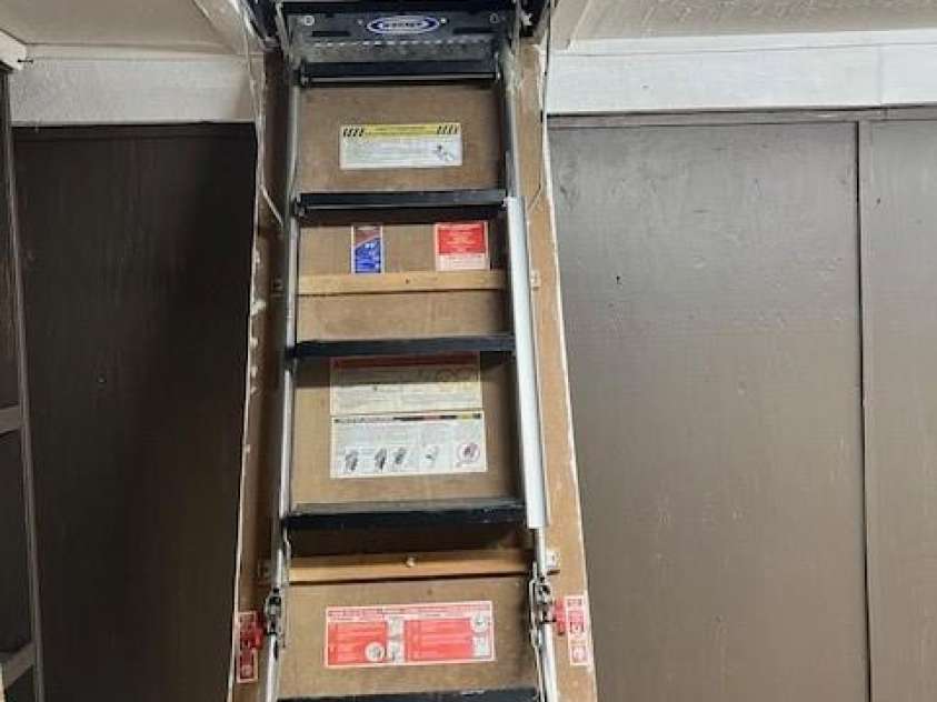 100 Goose Creek Road, Marion, NC 28752.  MLS# CAR4166247, YatesRealty ID 2745. Steps to attic in red building