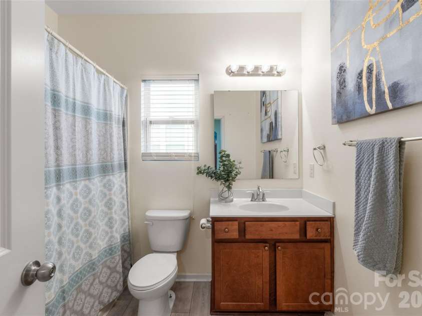 10229 Snowbell Court, Charlotte, NC 28215.  MLS# CAR4338183, YatesRealty ID 2745. Main floor bathroom