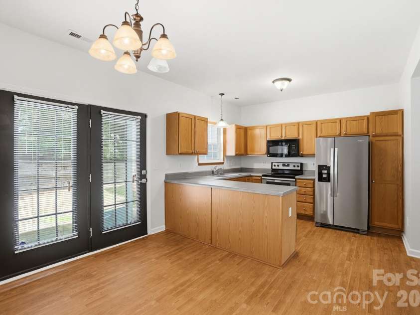 5315 Jocelyn Lane, Charlotte, NC 28269.  MLS# CAR4387226, YatesRealty ID 27454. Dining Area into Kitchen