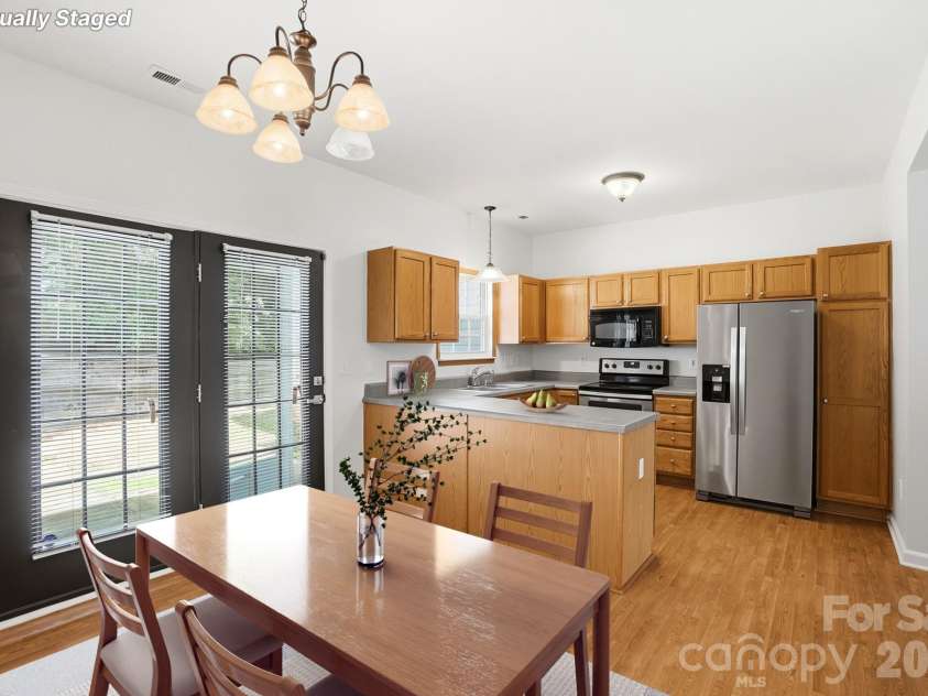 5315 Jocelyn Lane, Charlotte, NC 28269.  MLS# CAR4387226, YatesRealty ID 27454. Dining Area into Kitchen / Virtually Staged