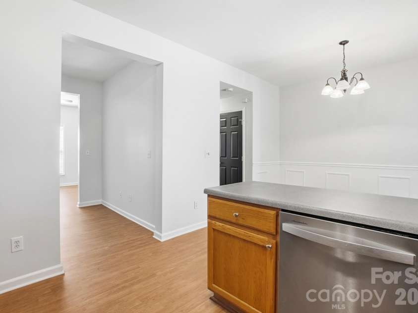 5315 Jocelyn Lane, Charlotte, NC 28269.  MLS# CAR4387226, YatesRealty ID 27454. Kitchen into Dining & Office
