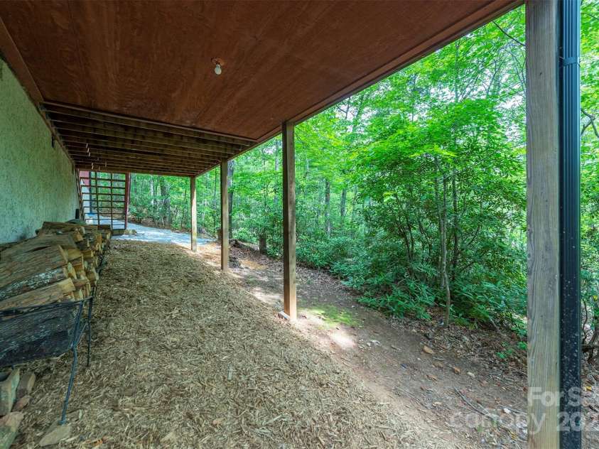 114 Richard Lane, Black Mountain, NC 28711.  MLS# CAR4270307, YatesRealty ID 27456. Covered storage under the deck and sunroom.