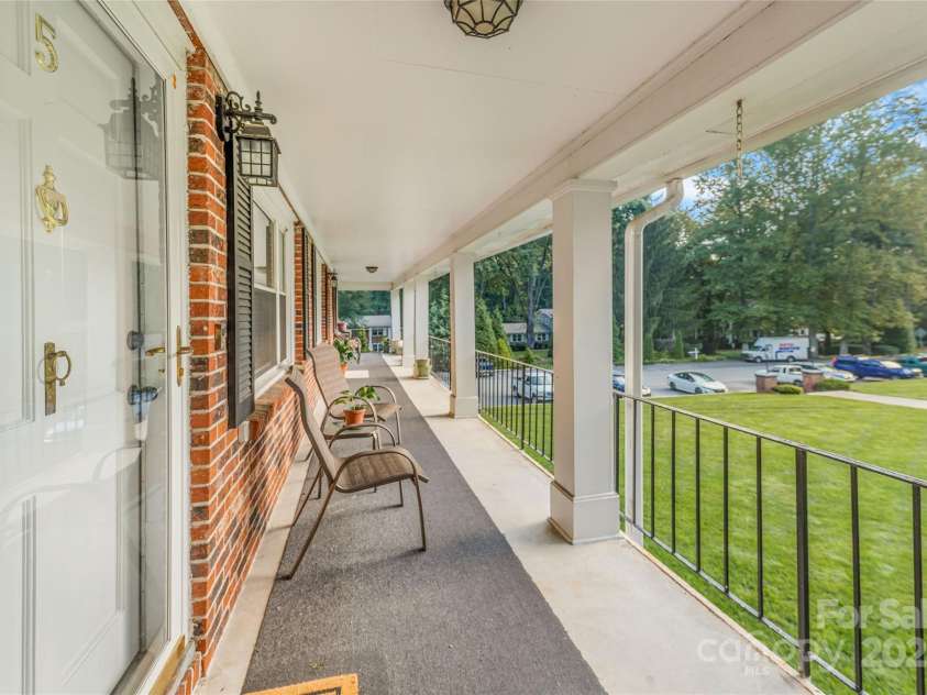 102 Boyd Drive, Flat Rock, NC 28731.  MLS# CAR4291135, YatesRealty ID 27464. View down the porch