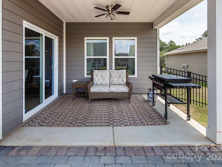 3313 Plum Drive, Monroe, NC 28110.  MLS# CAR4274387, YatesRealty ID 27465. Relax under the covered porch.