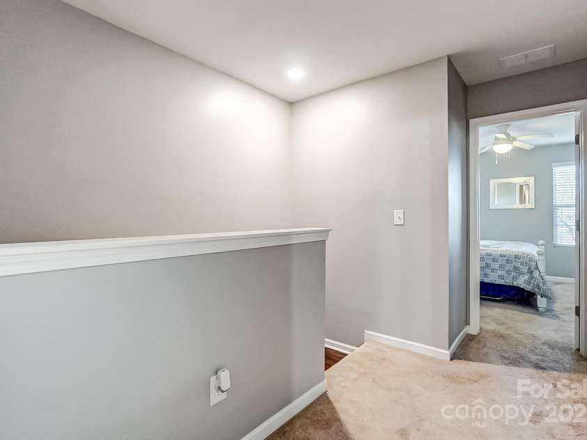 3033 Honeylocust Lane, Fort Mill, SC 29707.  MLS# CAR4214279, YatesRealty ID 2747. Upstairs Hallway