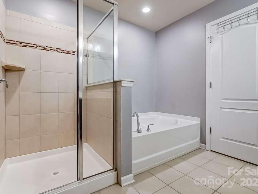 3033 Honeylocust Lane, Fort Mill, SC 29707.  MLS# CAR4214279, YatesRealty ID 2747. Walk-in Shower and Garden Tub