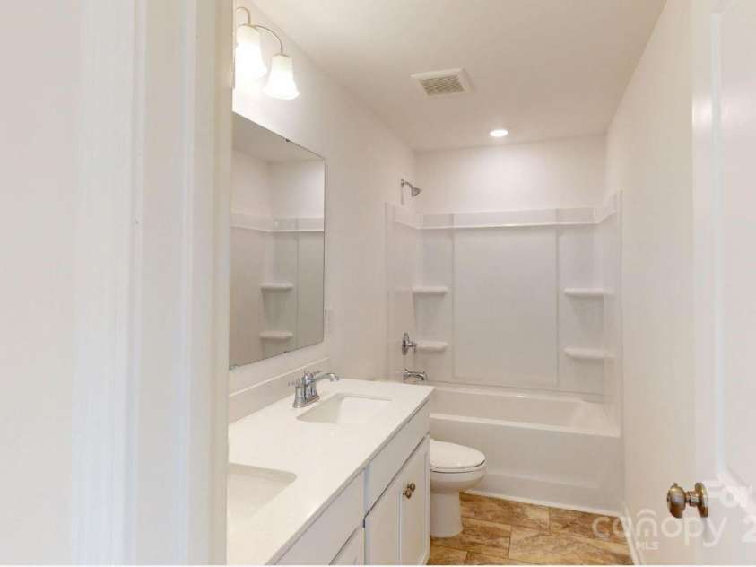 1821 Augustine Street, Monroe, NC 28112.  MLS# CAR4272882, YatesRealty ID 27471. Secondary bathroom