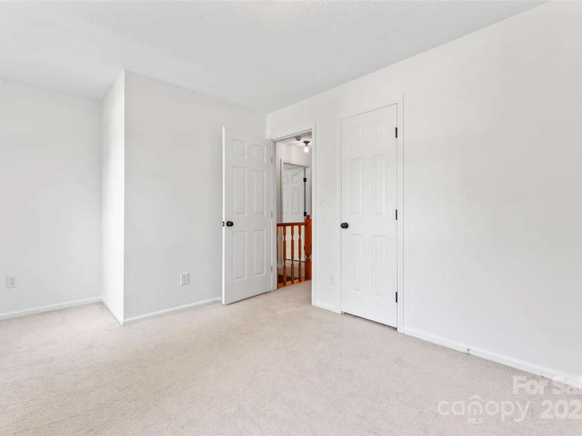 9833 White Cascade Drive, Charlotte, NC 28269.  MLS# CAR4275187, YatesRealty ID 27475. Bedroom #2 with laundry chute in closet