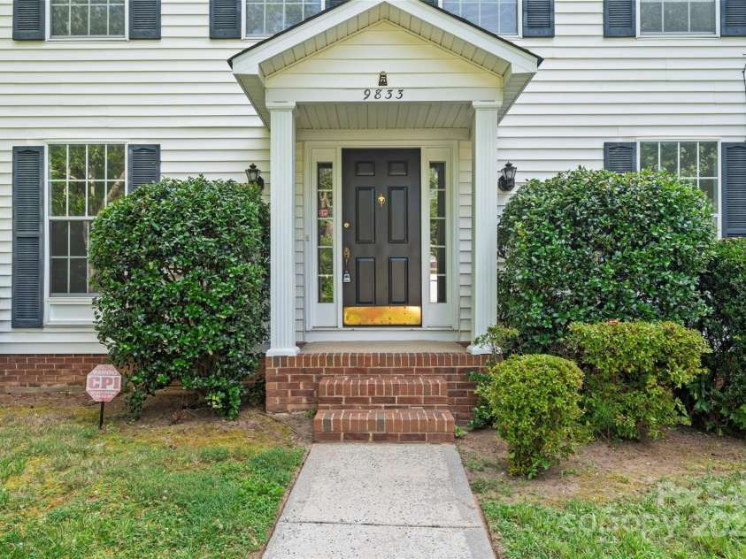 9833 White Cascade Drive, Charlotte, NC 28269.  MLS# CAR4275187, YatesRealty ID 27475. Covered front porch