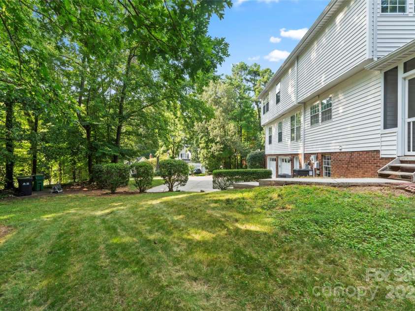 9833 White Cascade Drive, Charlotte, NC 28269.  MLS# CAR4275187, YatesRealty ID 27475. Exterior back