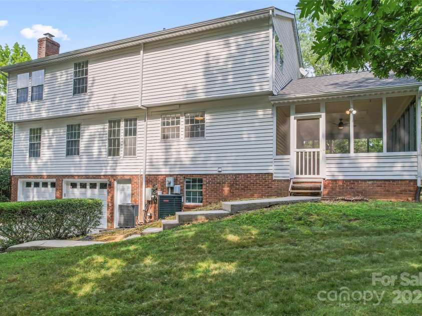 9833 White Cascade Drive, Charlotte, NC 28269.  MLS# CAR4275187, YatesRealty ID 27475. Exterior back and screened side porch