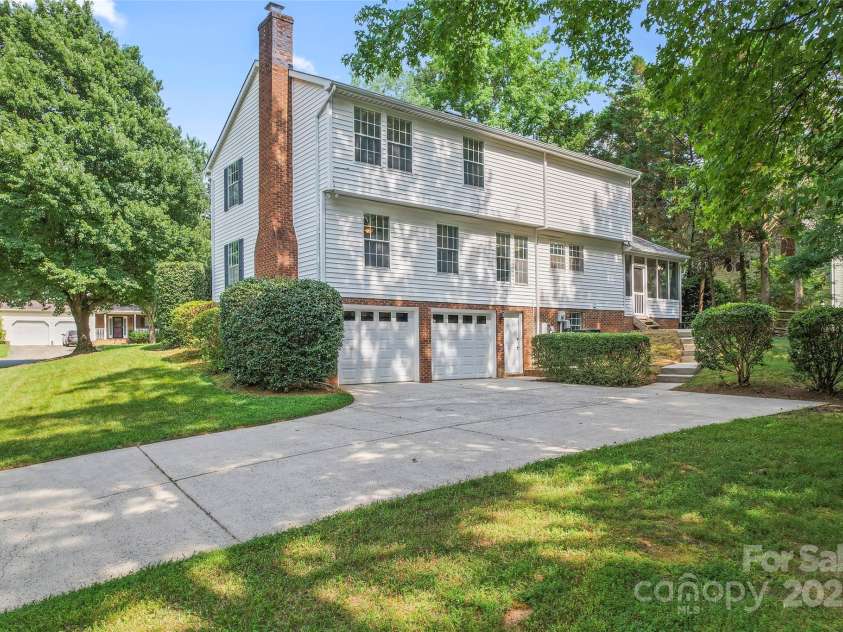 9833 White Cascade Drive, Charlotte, NC 28269.  MLS# CAR4275187, YatesRealty ID 27475. Exterior Back with garage entrance