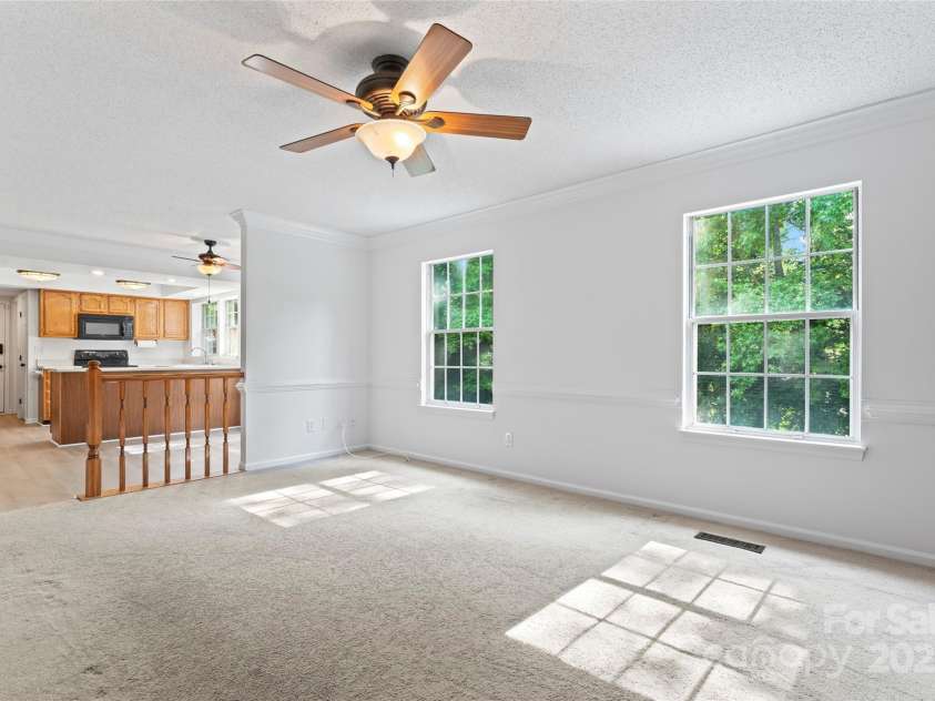 9833 White Cascade Drive, Charlotte, NC 28269.  MLS# CAR4275187, YatesRealty ID 27475. Family room
