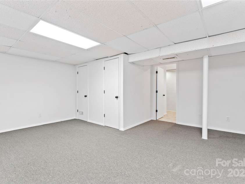9833 White Cascade Drive, Charlotte, NC 28269.  MLS# CAR4275187, YatesRealty ID 27475. Large finished room in basement
