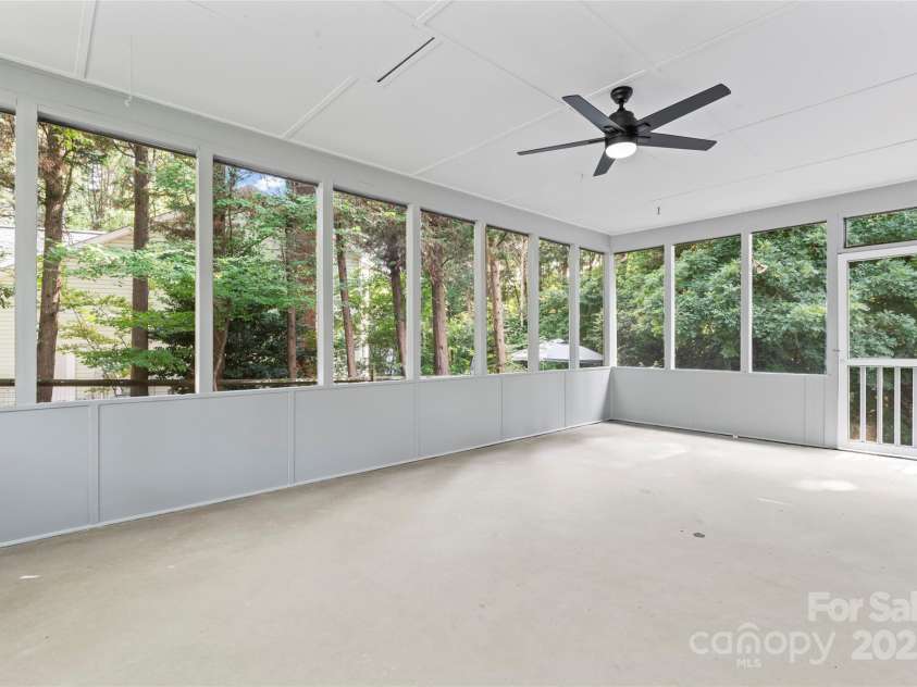 9833 White Cascade Drive, Charlotte, NC 28269.  MLS# CAR4275187, YatesRealty ID 27475. Large screened side porch