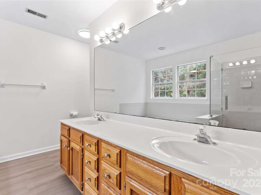 9833 White Cascade Drive, Charlotte, NC 28269.  MLS# CAR4275187, YatesRealty ID 27475. Primary bathroom with double vanities