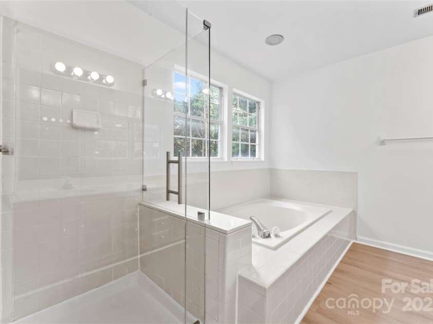 9833 White Cascade Drive, Charlotte, NC 28269.  MLS# CAR4275187, YatesRealty ID 27475. Primary bathroom with separate tub and shower