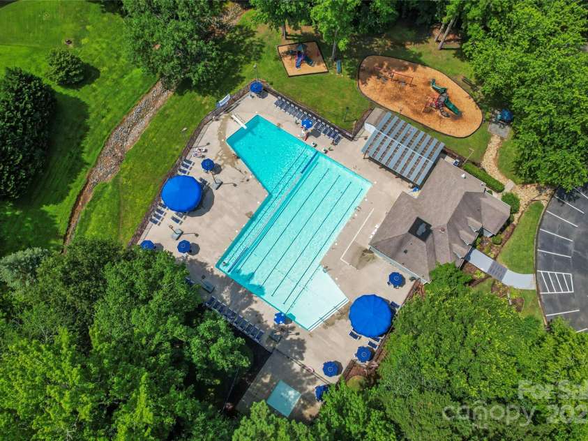 9833 White Cascade Drive, Charlotte, NC 28269.  MLS# CAR4275187, YatesRealty ID 27475. Winchester outdoor pool and playground