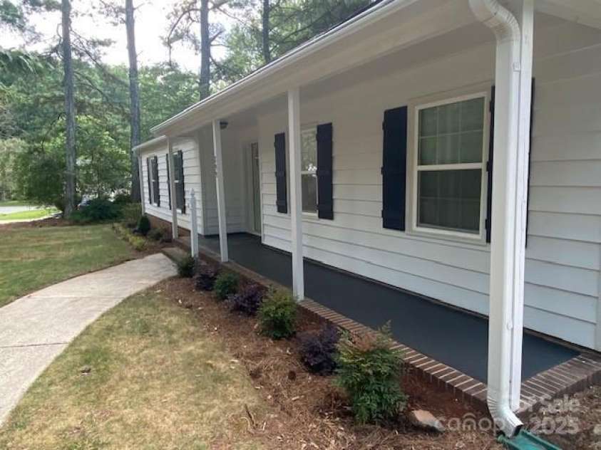 709 Falls Church Road, Charlotte, NC 28270.  MLS# CAR4275080, YatesRealty ID 27488. Covered Entry with new landscaping