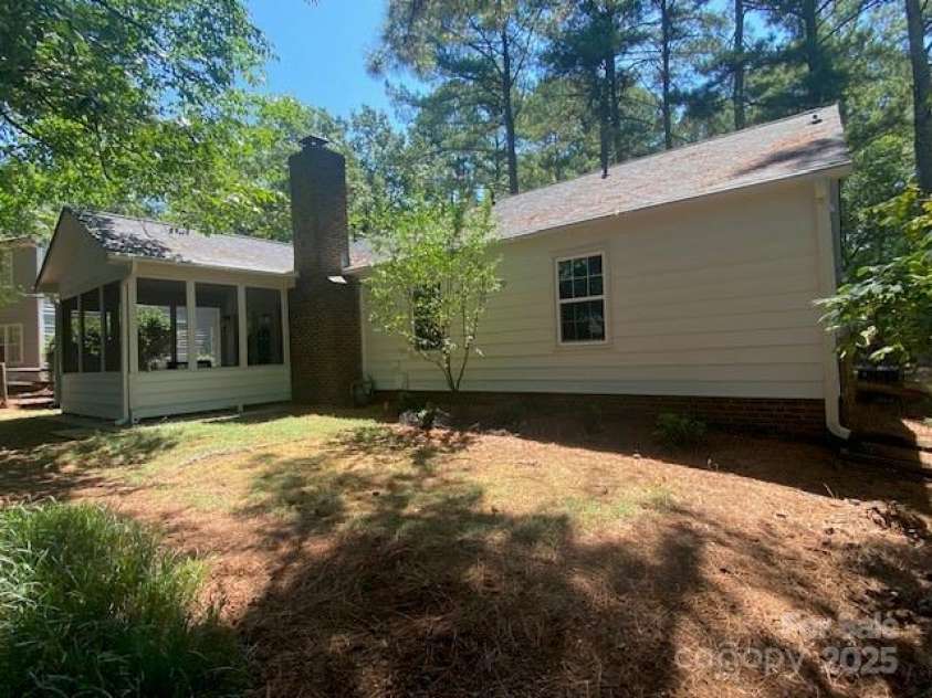 709 Falls Church Road, Charlotte, NC 28270.  MLS# CAR4275080, YatesRealty ID 27488. Screen Porch with Hydrangea landscaping