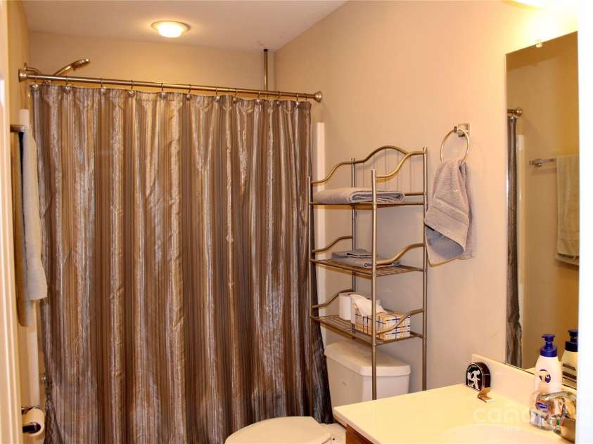 50 Duncan Road, Flat Rock, NC 28731.  MLS# CAR4274079, YatesRealty ID 2749. Hall bath with tub/shower