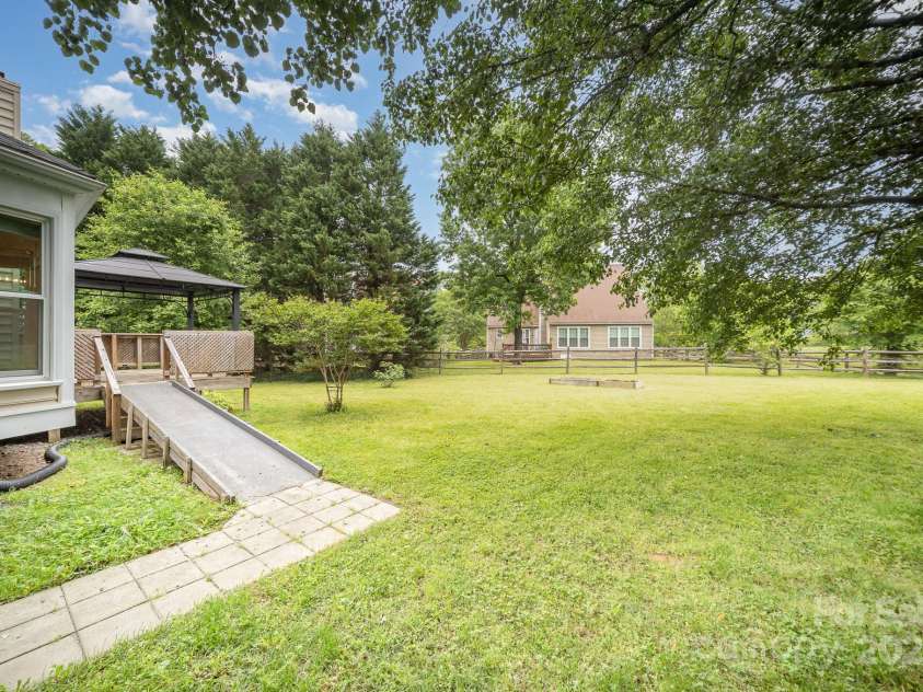 7106 Kinsmore Lane, Charlotte, NC 28269.  MLS# CAR4250943, YatesRealty ID 27491. Back of home