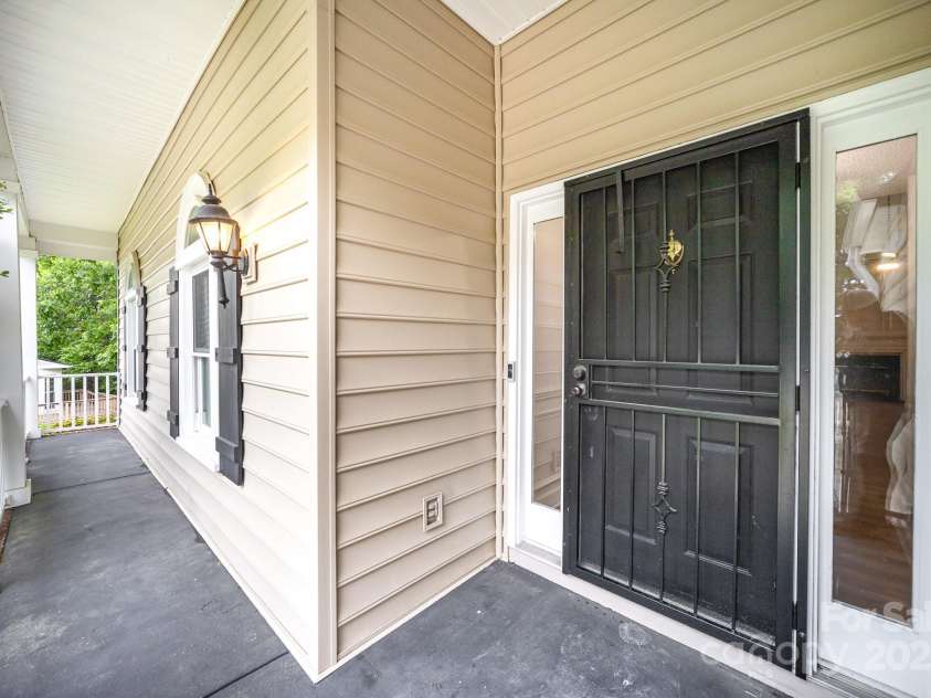 7106 Kinsmore Lane, Charlotte, NC 28269.  MLS# CAR4250943, YatesRealty ID 27491. Front porch
