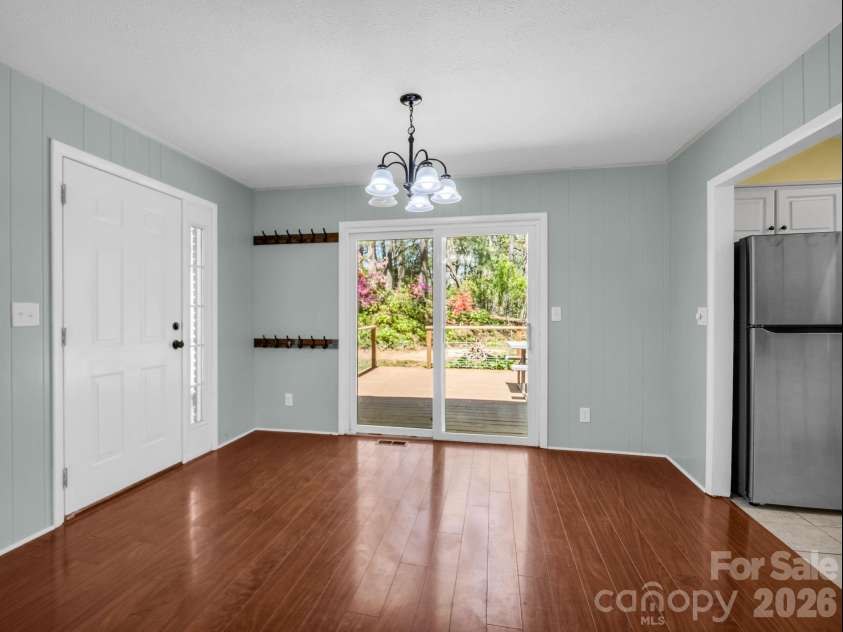 31 Firefly Lane, Saluda, NC 28773.  MLS# CAR4370921, YatesRealty ID 27498. Carport and back deck access of dining area