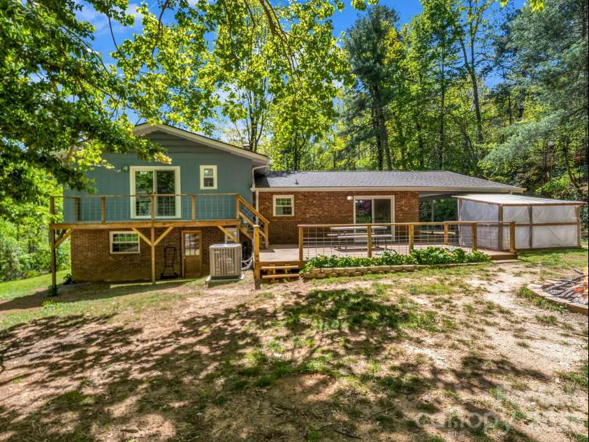 31 Firefly Lane, Saluda, NC 28773.  MLS# CAR4370921, YatesRealty ID 27498. Great deck and over sized backyard