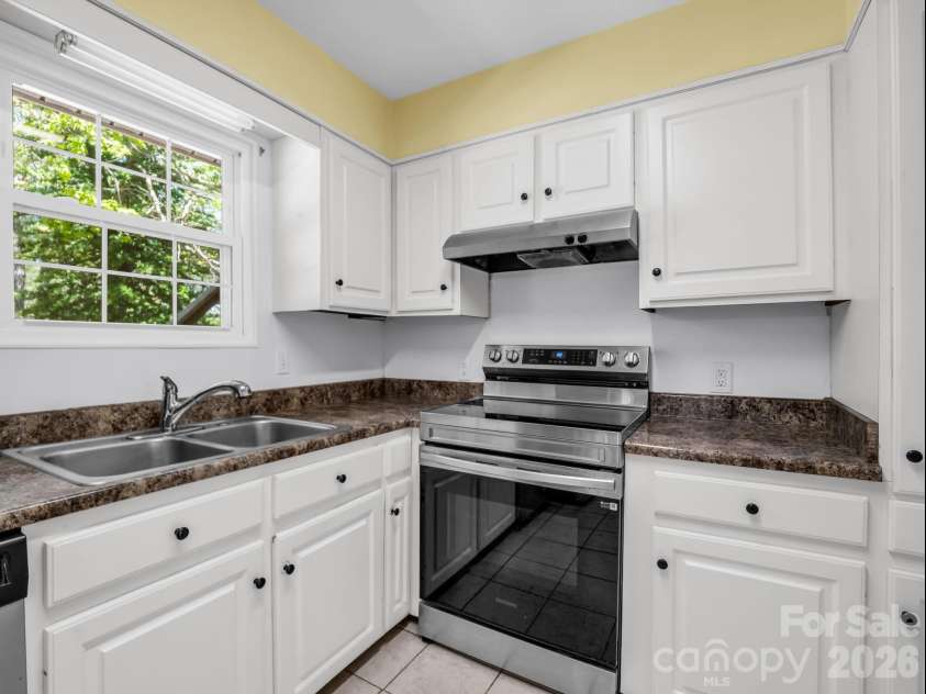 31 Firefly Lane, Saluda, NC 28773.  MLS# CAR4370921, YatesRealty ID 27498. Kitchen window over looking backyard