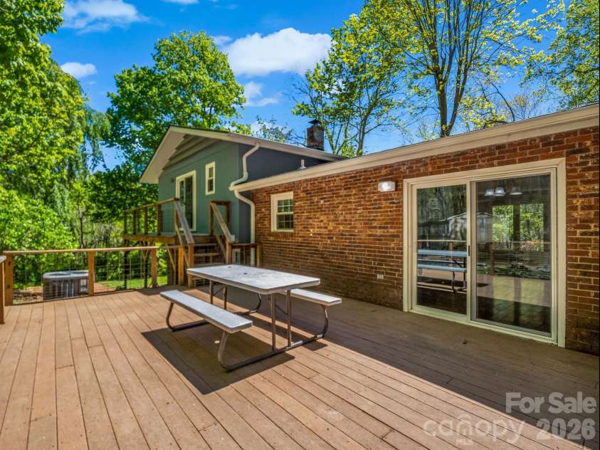 31 Firefly Lane, Saluda, NC 28773.  MLS# CAR4370921, YatesRealty ID 27498. Large Deck off Dining Area