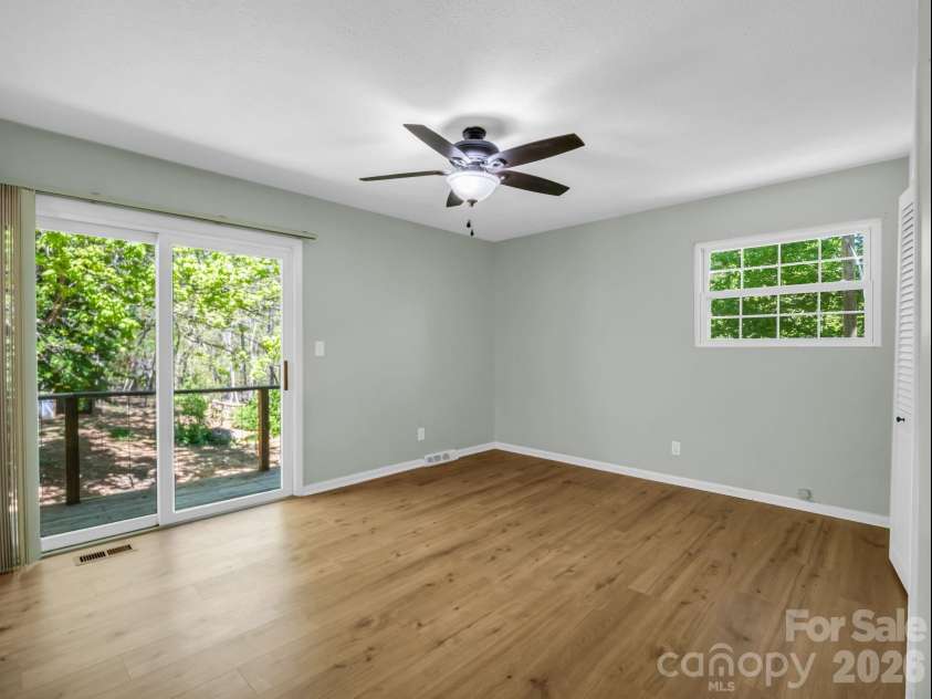 31 Firefly Lane, Saluda, NC 28773.  MLS# CAR4370921, YatesRealty ID 27498. Main Bedroom with deck and backyard