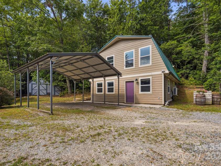1101 Line Runner Ridge Road, Rosman, NC 28772.  MLS# CAR4280963, YatesRealty ID 27502. Front of home with double (portable) carport