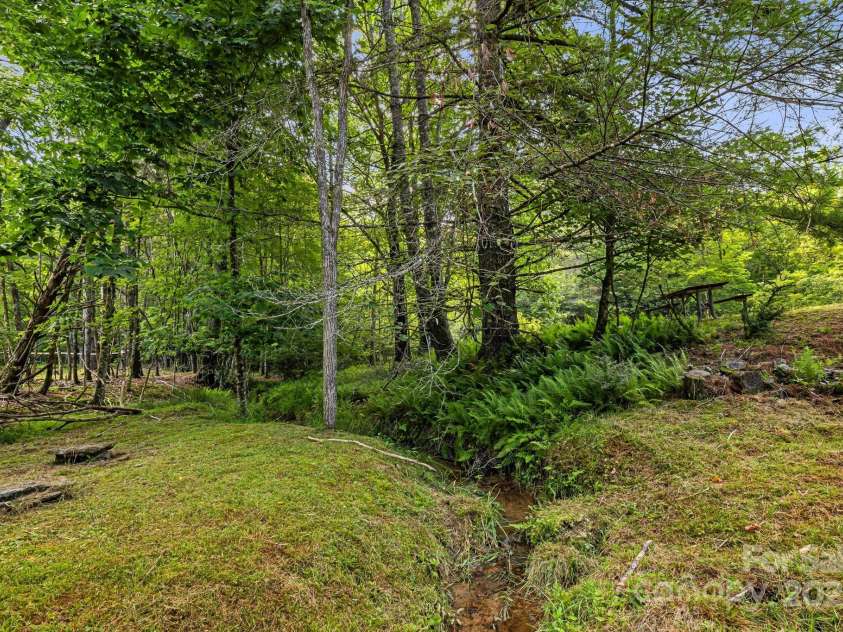 1101 Line Runner Ridge Road, Rosman, NC 28772.  MLS# CAR4280963, YatesRealty ID 27502. Lovely meandering creek