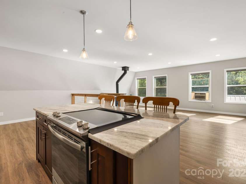 1101 Line Runner Ridge Road, Rosman, NC 28772.  MLS# CAR4280963, YatesRealty ID 27502. Overlooking living and dining areas from kitchen